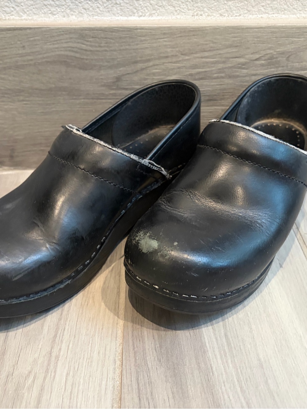 Dansko Black Leather Women’s Slip-On Clogs